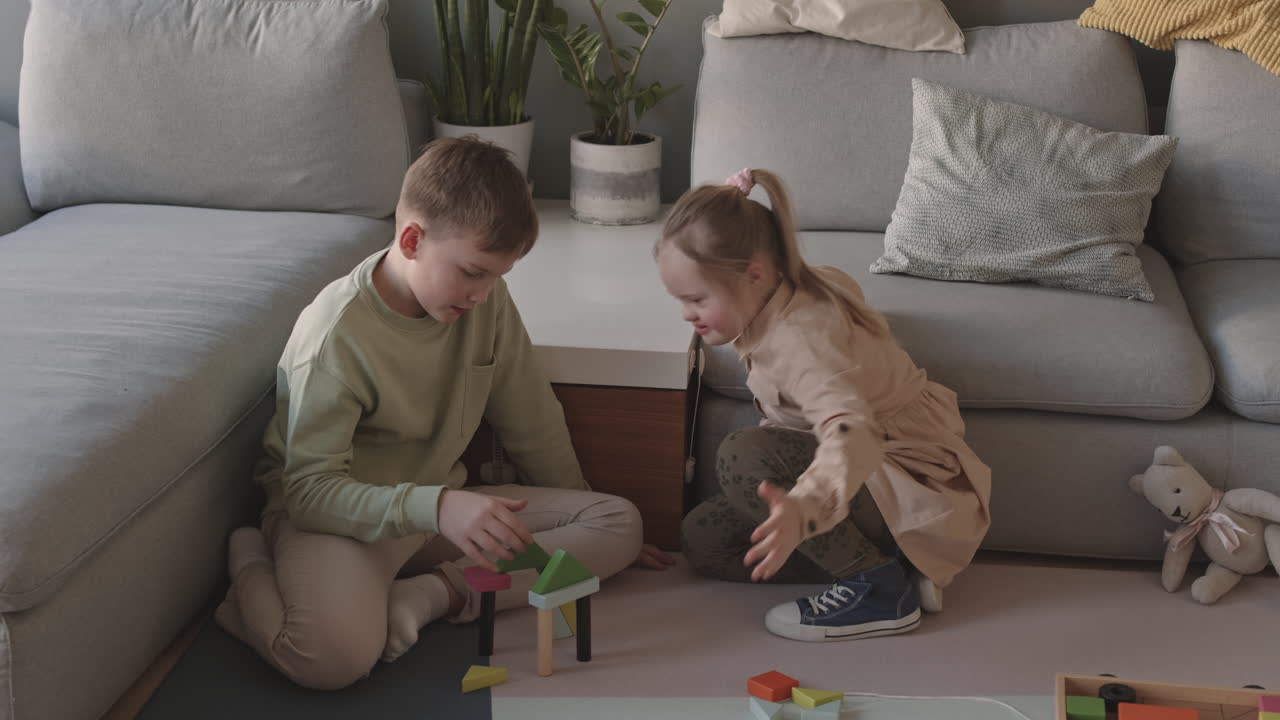 Siblings Playing with Blocks