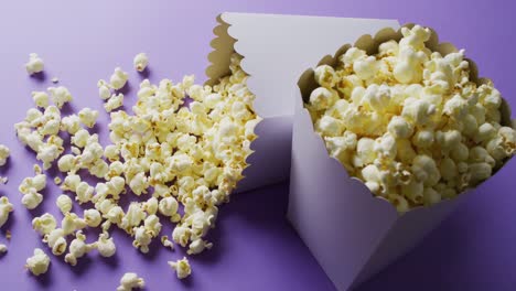 Video-of-close-up-of-popcorn-on-blue-background