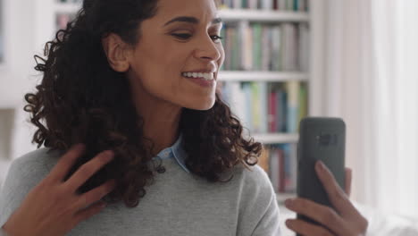 beautiful-mixed-race-woman-having-video-chat-using-smartphone-at-home-showing-off-hairstyle-chatting-to-friend-sharing-lifestyle-enjoying-online-communication-4k-footage