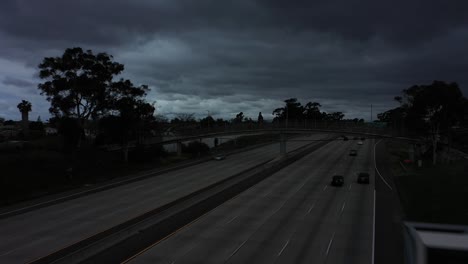 aerial sign along a darkened freeway tells people to avoid travel during the covid19 coronavirus epidemic outbreak 1