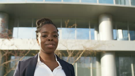 Closeup-View-Of-Beautiful-Businesswoman-In-Formal-Wear-Standing-Outdoors-And-Smiling-At-Camera