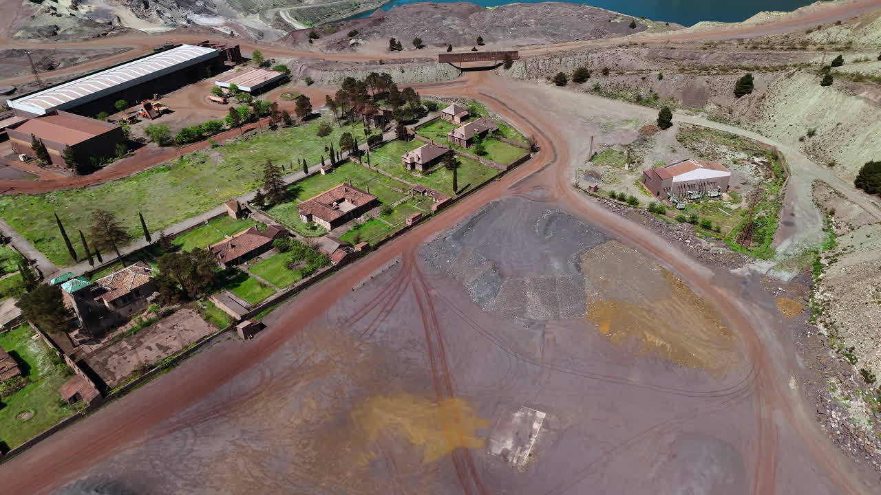 Abandoned buildings near an open pit mine.