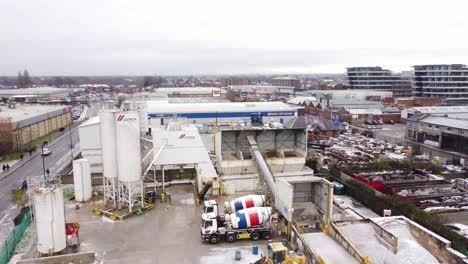 Industrial-CEMEX-concrete-manufacturing-storage-yard-aerial-view-with-trucks-parked-around-machinery