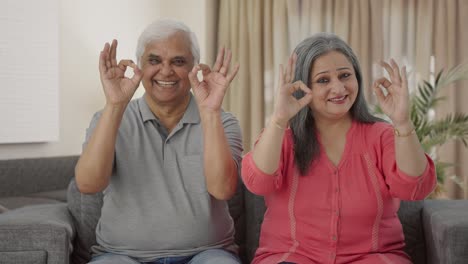 Happy-Indian-old-couple-showing-okay-sign