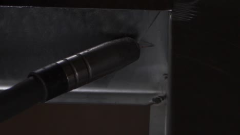 welder works in metal construction - construction and processing of steel components, slow motion