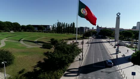 giant portugal flag winding in portuguese city capital aerial view