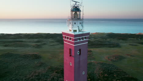 aerial circling of a brick lighthouse in westhoofd near ouddorp, the netherlands