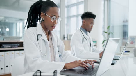 doctor, hospital team and laptop working