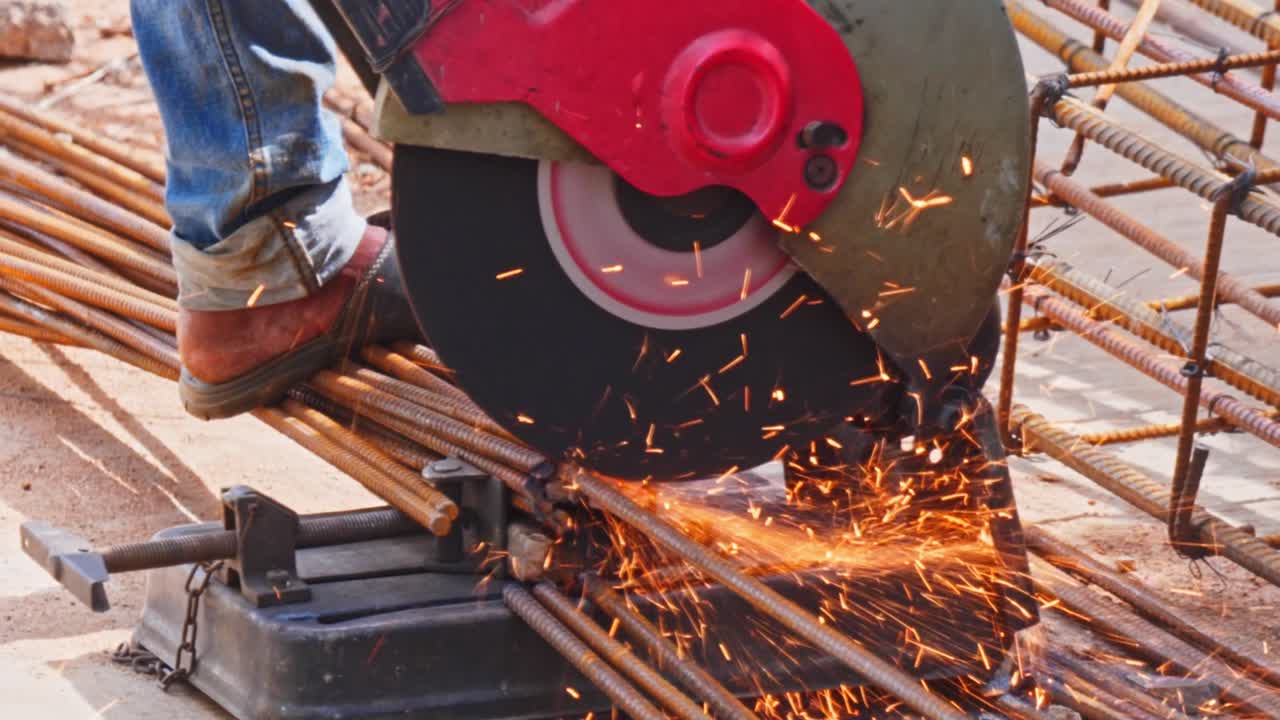 person using Circular saw to cut a rebar. day time, zoom out shot, 4k