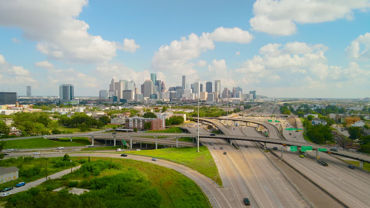 Aerial Establishing Downtown Houston Texas, skyline Traffic Skyscraper buildings, famous American city, Texas 288 freeway. Drone shoot the Texas 288 overlooking Houston Downtown. Houston Intro