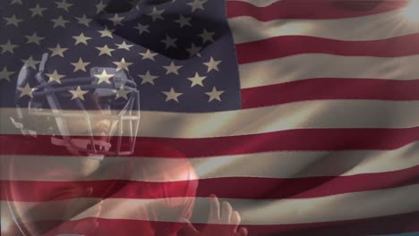 animation of flag of usa over caucasian male american football player