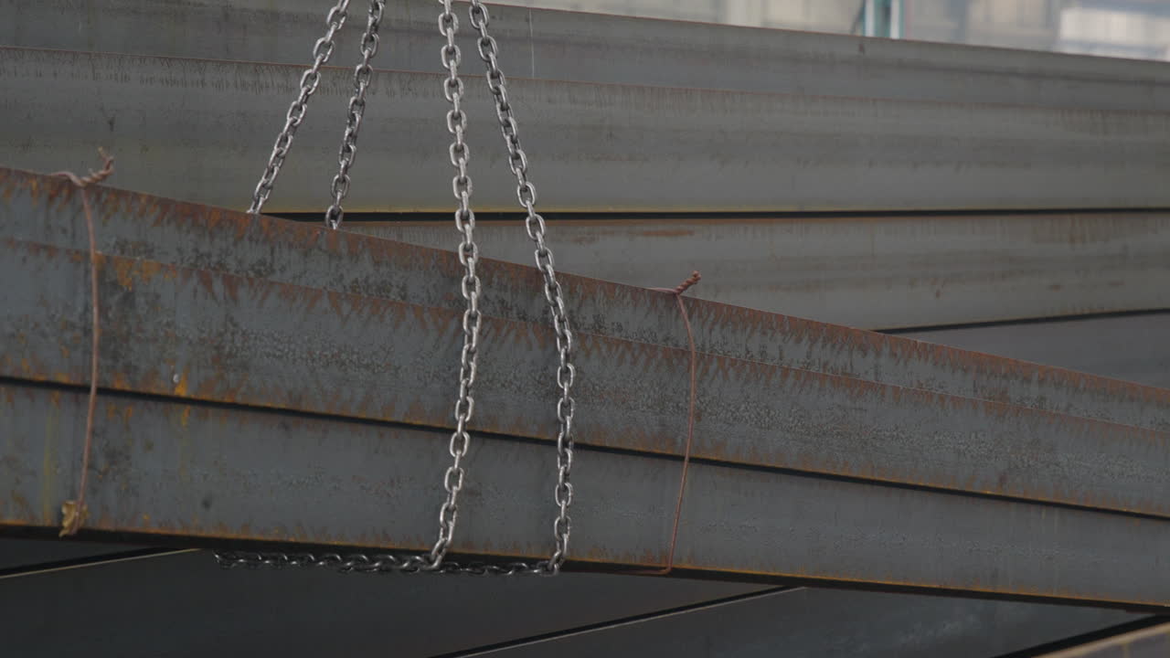 metal beams being supported by a gantry to the floor slow motion close shot