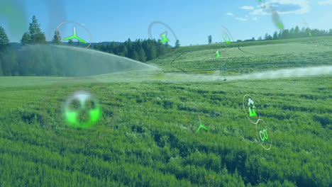 animación de iconos de ecología sobre el paisaje con rociador de agua en el campo