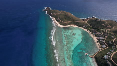 aerial view, british virgin islands coastline, coral reefs and beachfront resort