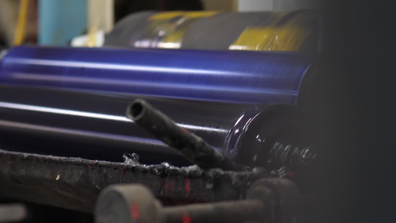 Close Up Of Metal Rollers In Factory Turning