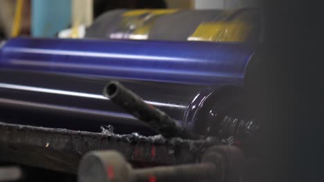 close up of metal rollers in factory turning