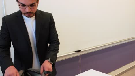 male lecturer in modern classroom setting