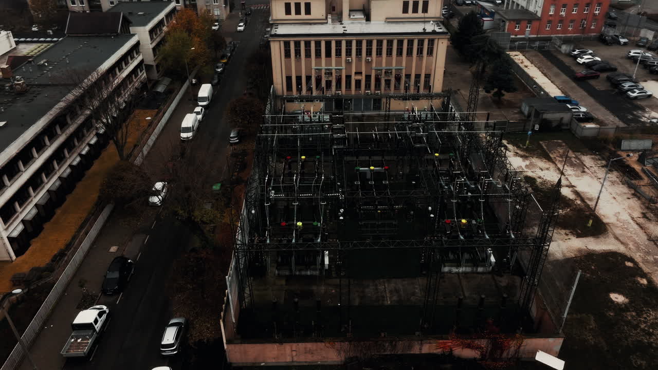 Industrial electrical substation of Budapest on a cold, overcast day. Dark monotone mood with power lines, transformers, and urban infrastructure in gloomy Eastern Europe weather