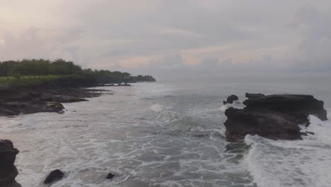 Rock-Formations-on-Bali's-Tabanan-Exotic-Tropical-Coastline,-Aerial-Flight