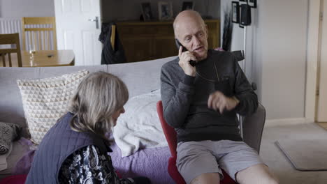Elderly couple at home having a conversation