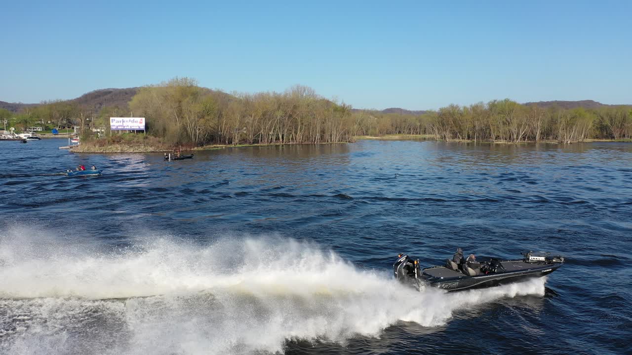 Aerial View of a Speeding Motorboat on a Scenic River