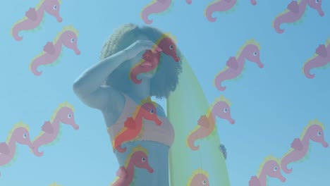 animation of seahorse over african american woman at beach