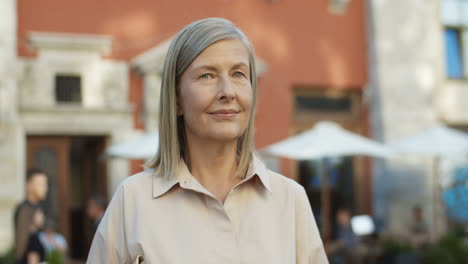 Close-Up-Of-Joyful-Pretty-Gray-Haired-Old-Woman-Smiling-Outdoor