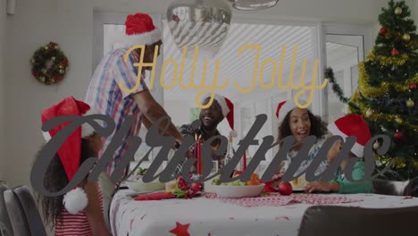 Animation-of-christmas-greetings-text-with-african-american-family-in-santa-hats-at-christmas