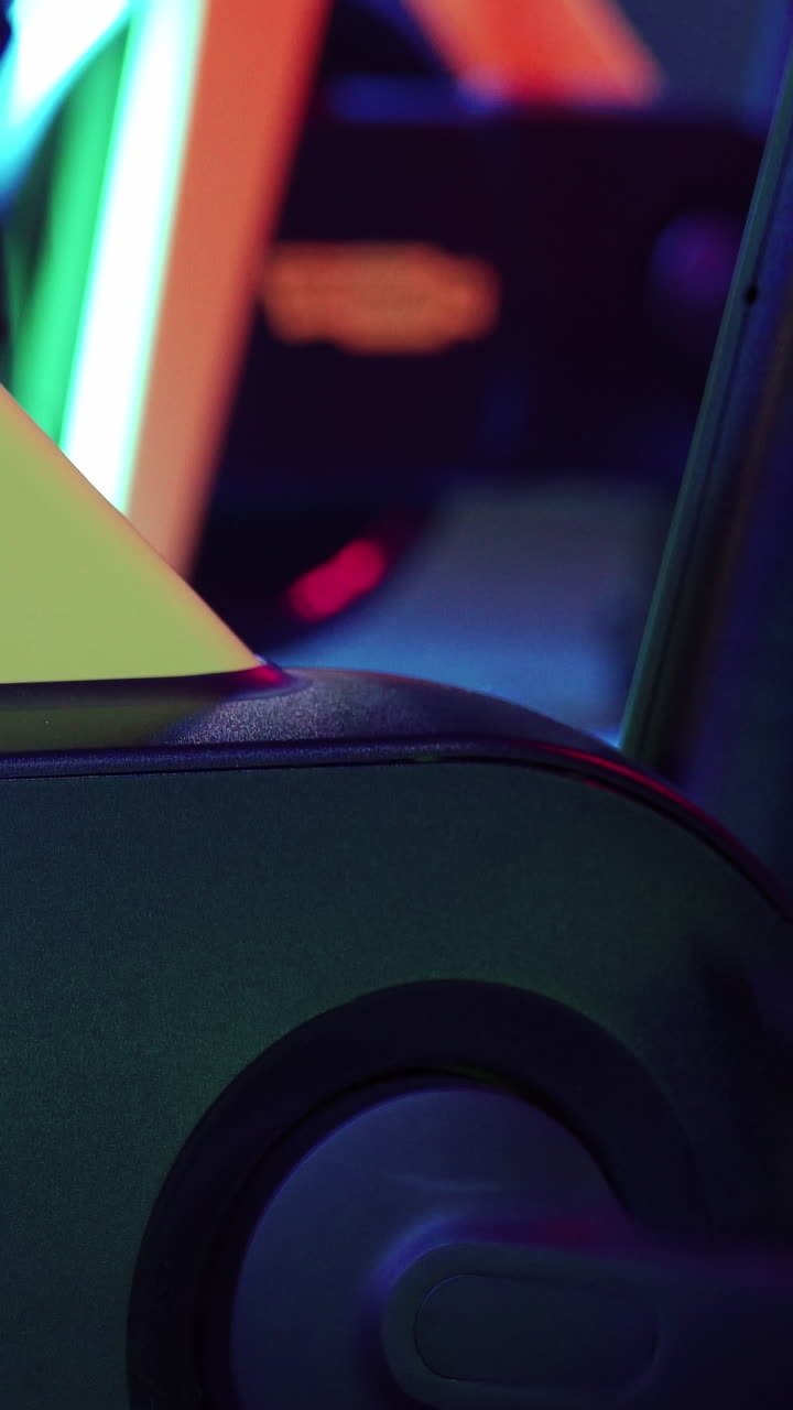 Cardio training on stationary bike. Sport gym man exercise with cycling machine in gym. Vertical video