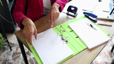 Woman working with documents at desk