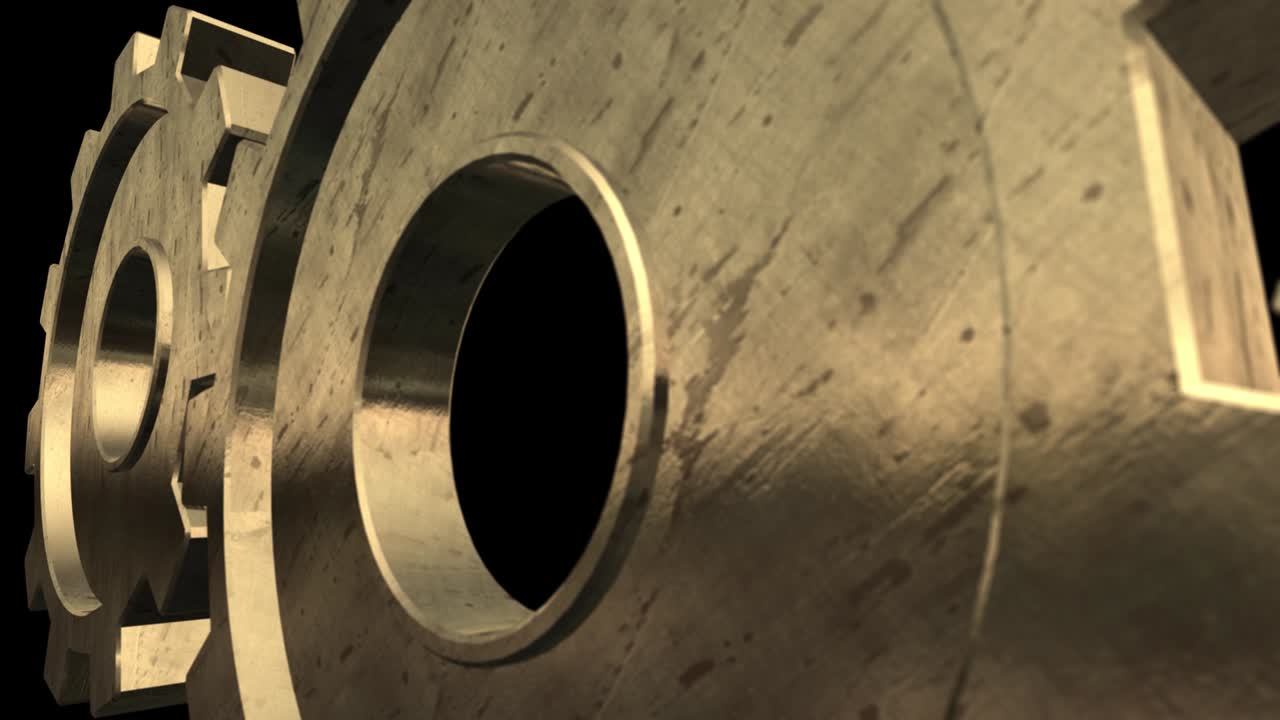 Old mechanism of the two gold gears is turning . Black background. Close up. Alpha channel