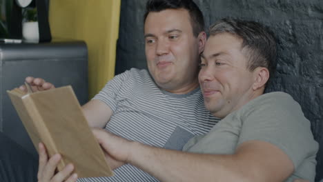 two men relaxing and reading together