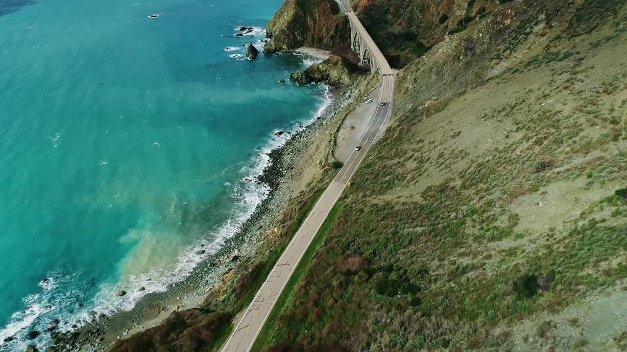 Scenic aerial over Pacific Coast Highway showing Bixby Bridge and cliffs