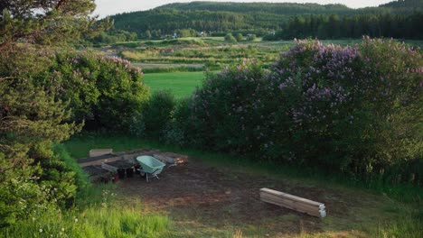 Small-Yard-With-Raised-Garden-Beds,-Wheelbarrow,-And-Pots