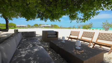 open-concept living area with outdoor furniture adorned with tasteful décor, ocean view