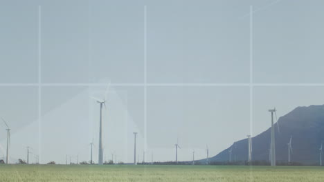 animación de múltiples gráficos sobre el patrón de cuadrícula y molinos de viento contra la montaña y el cielo