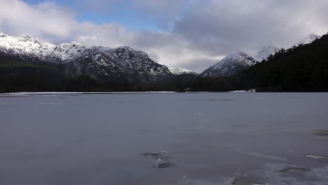 Time-lapse-of-frozen-lagoon-with-snow-capped-mountains-in-Patagonia,-Argentina