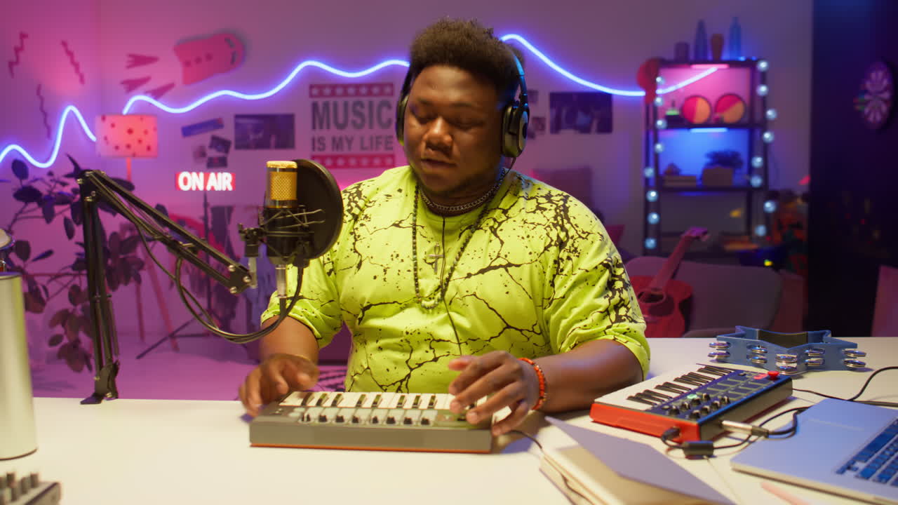 Young Black Man Recording Music in a Home Studio