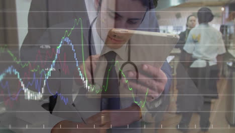 doctor writing notes holding tablet while analyzing finance graph overlay on restaurant kitchen