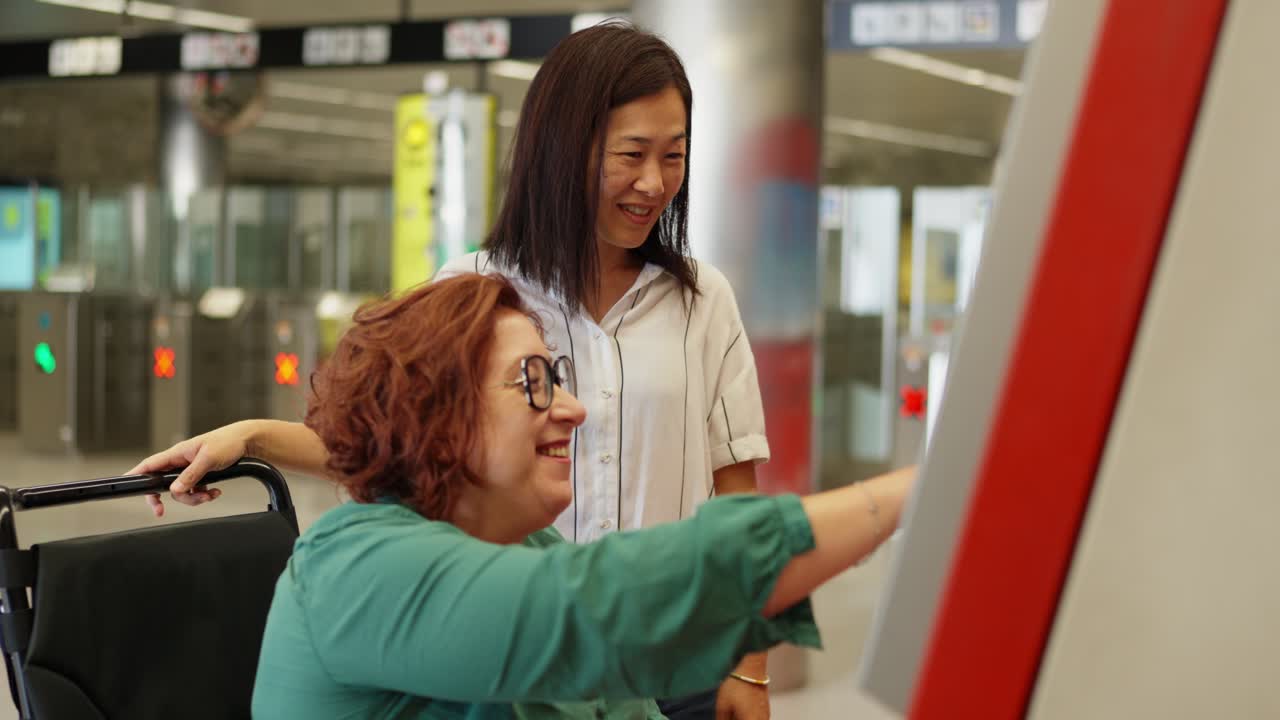 Women Using Accessible Technology in Subway