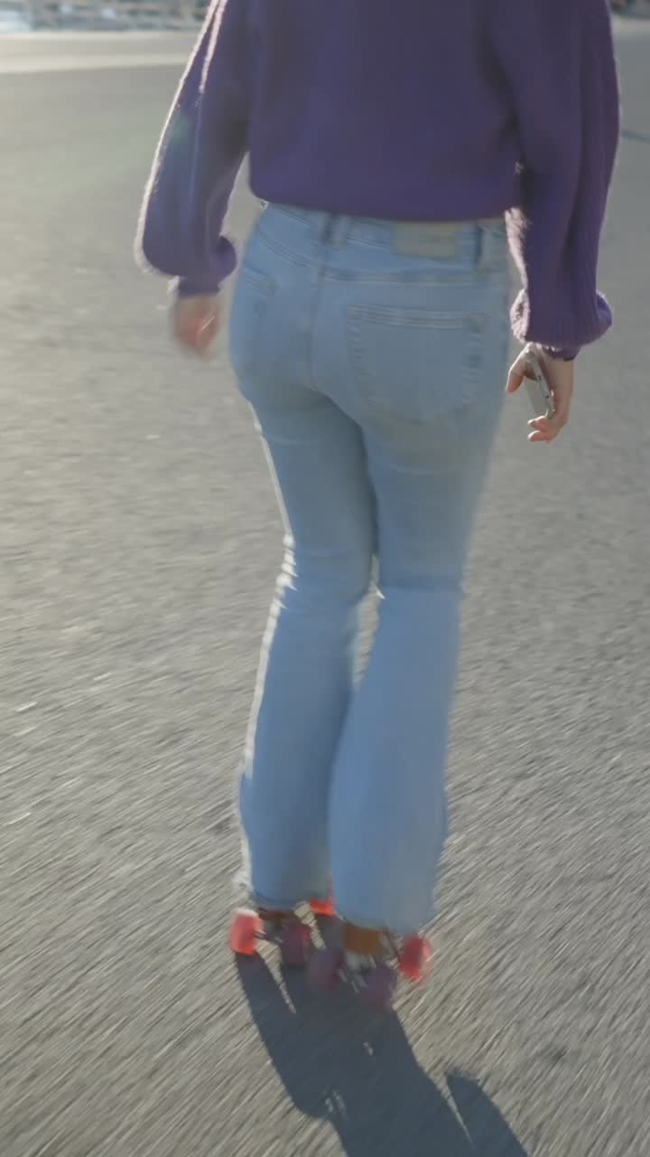 Person roller skating in flared jeans