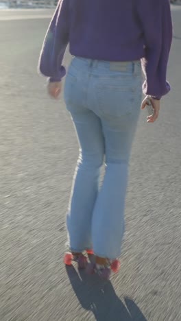 person roller skating in flared jeans