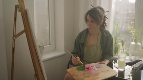 woman painting at home