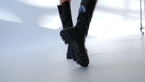 woman wearing black thigh high chunky boots
