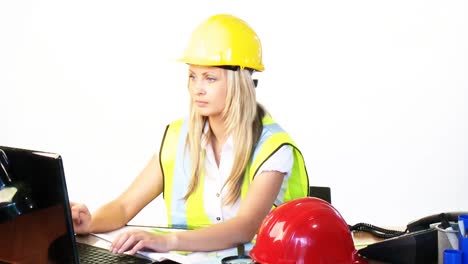 Blonde-female-architect-working-in-office