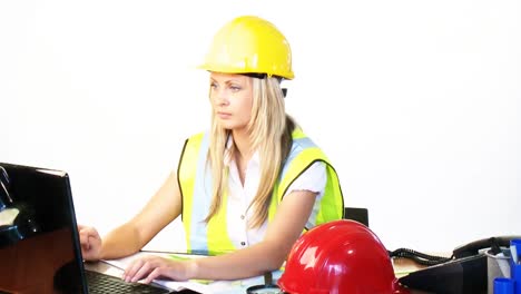 blonde female architect working in office