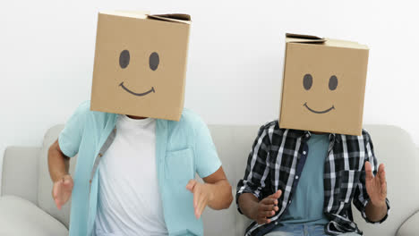 silly employees with boxes on their heads doing the robot