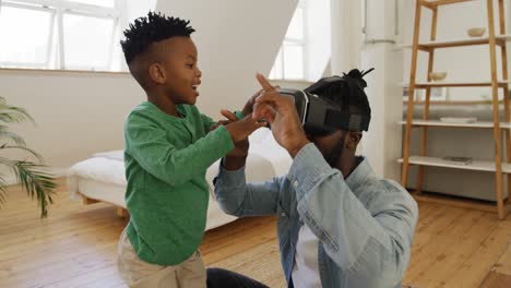 Father-and-son-at-home-using-VR