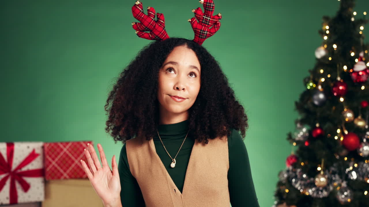 Festive woman celebrating Christmas with reindeer antlers