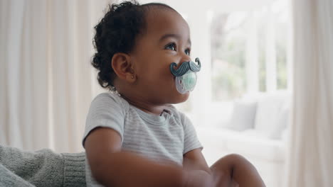 funny-baby-wearing-moustache-pacifier-happy-toddler-sucking-on-dummy-having-fun-cute-infant-enjoying-silly-humor-at-home-4k